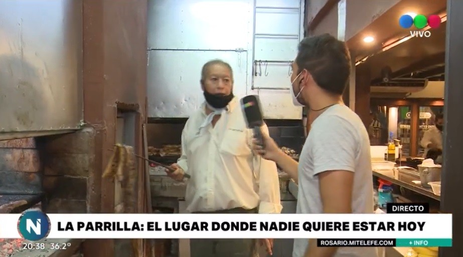 Cómo es trabajar en una parrilla en el día más caluroso del verano | Rosario y la región