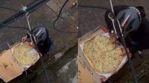 Video: un repartidor se comió una porción de pizza y lo camufló como un profesional